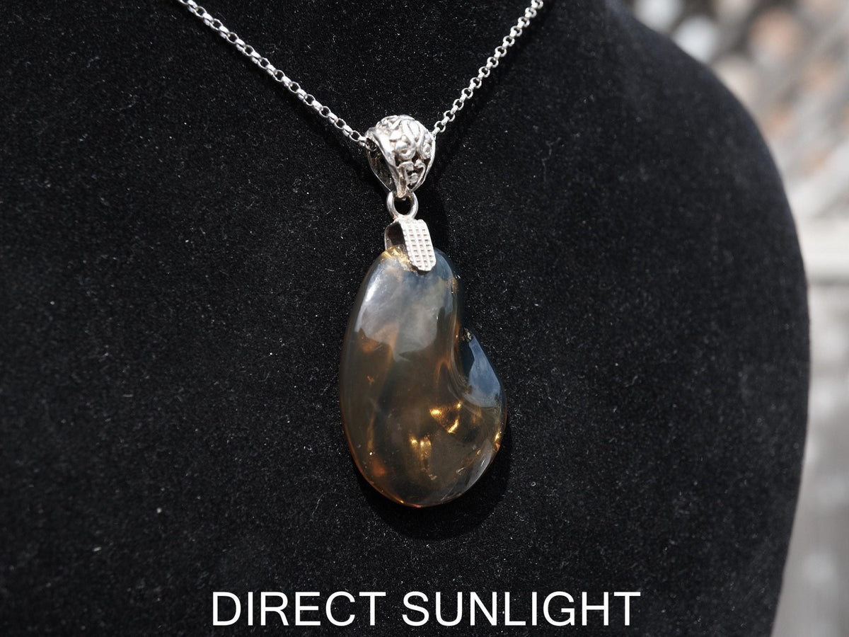 Rare Blue Amber Pendant - 925 Sterling Silver Bail - Larimar Creations