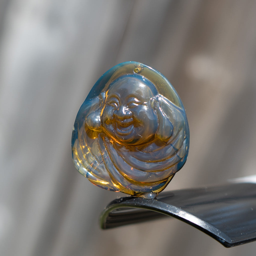 Dominican Blue Amber Buddha Pendant