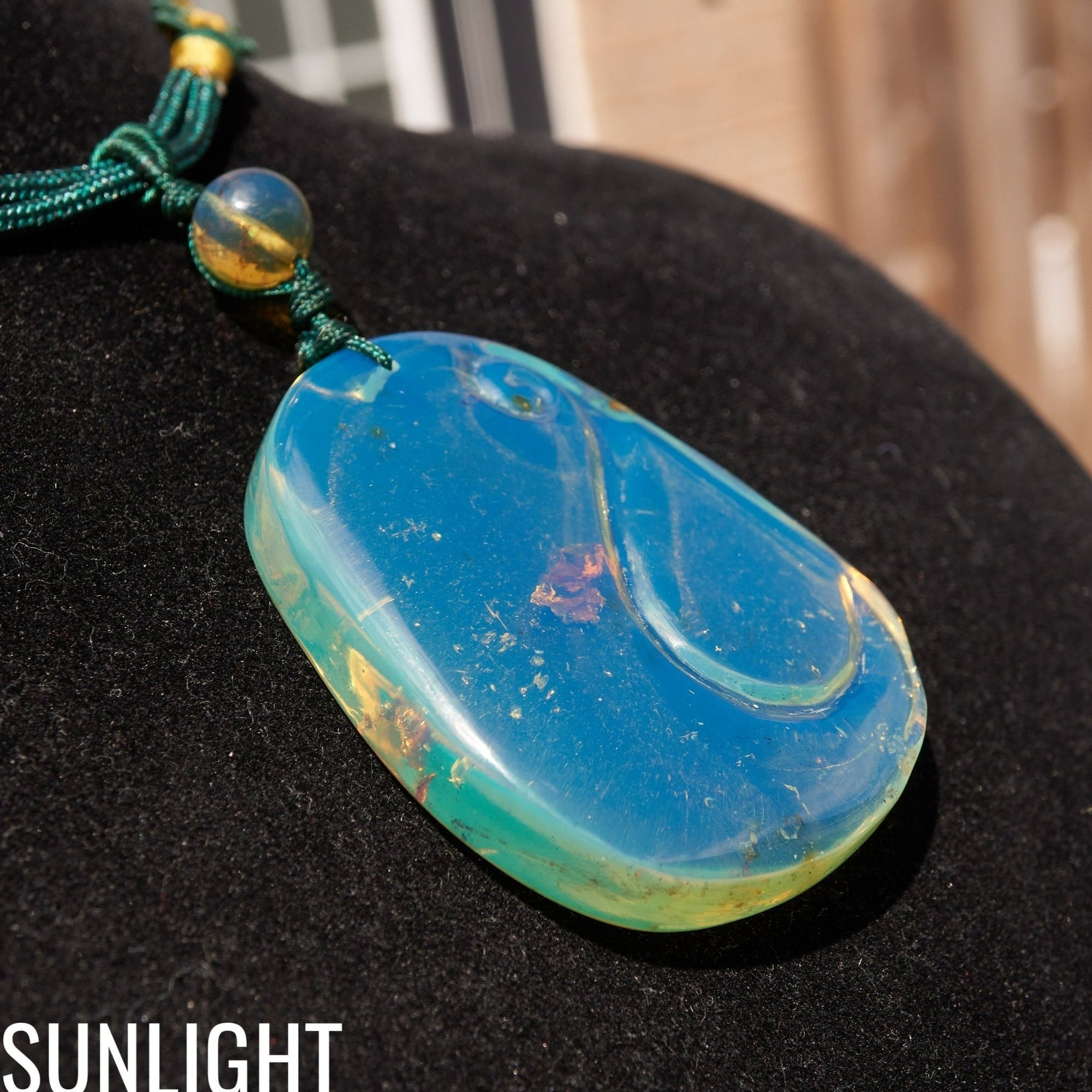 Blue Amber Dominican Pendant Necklace Bell carving shape. - Larimar Creations