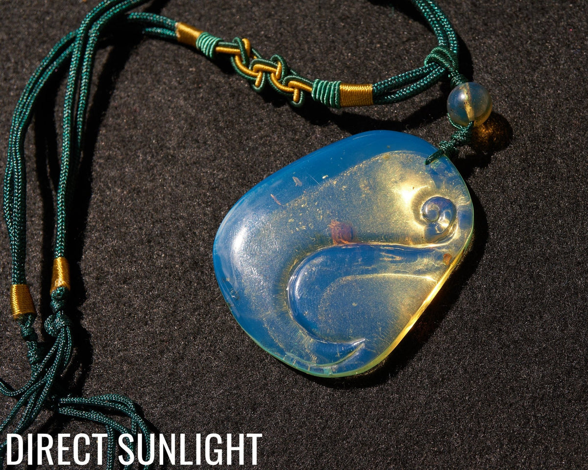 Blue Amber Dominican Pendant Necklace Bell carving shape. - Larimar Creations