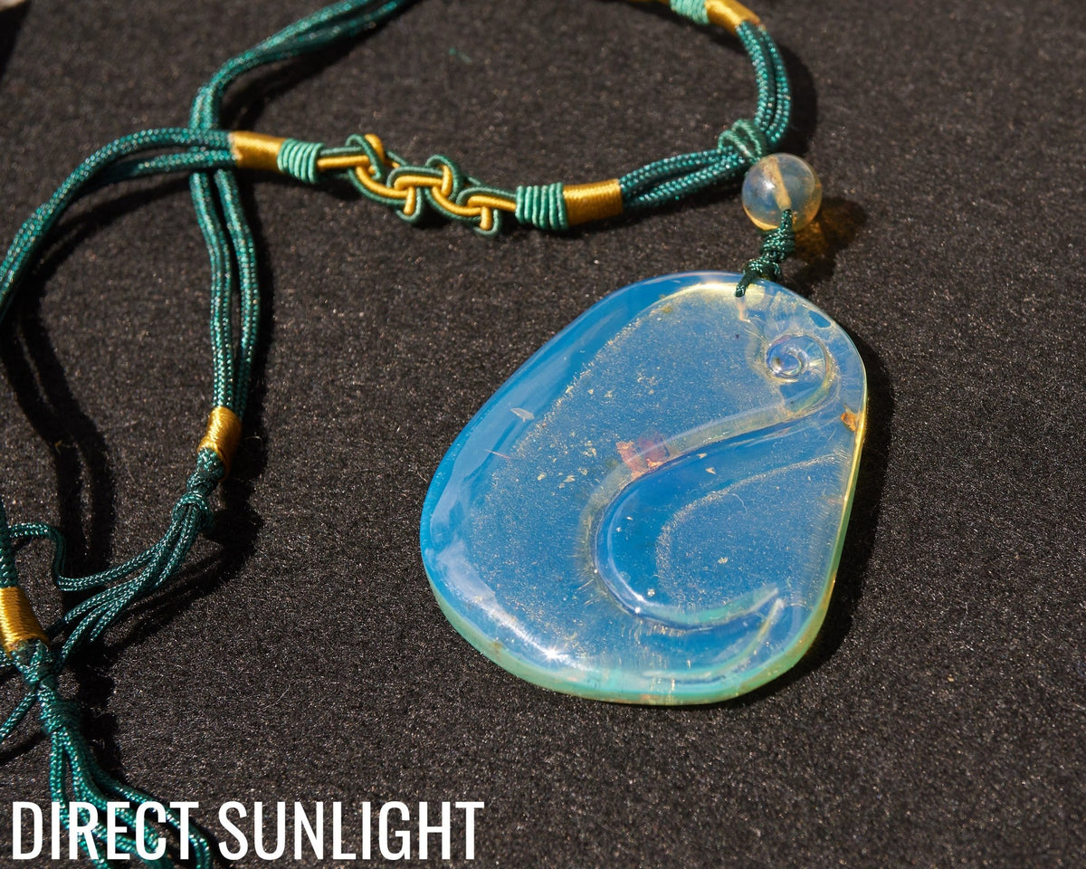Blue Amber Dominican Pendant Necklace Bell carving shape. - Larimar Creations