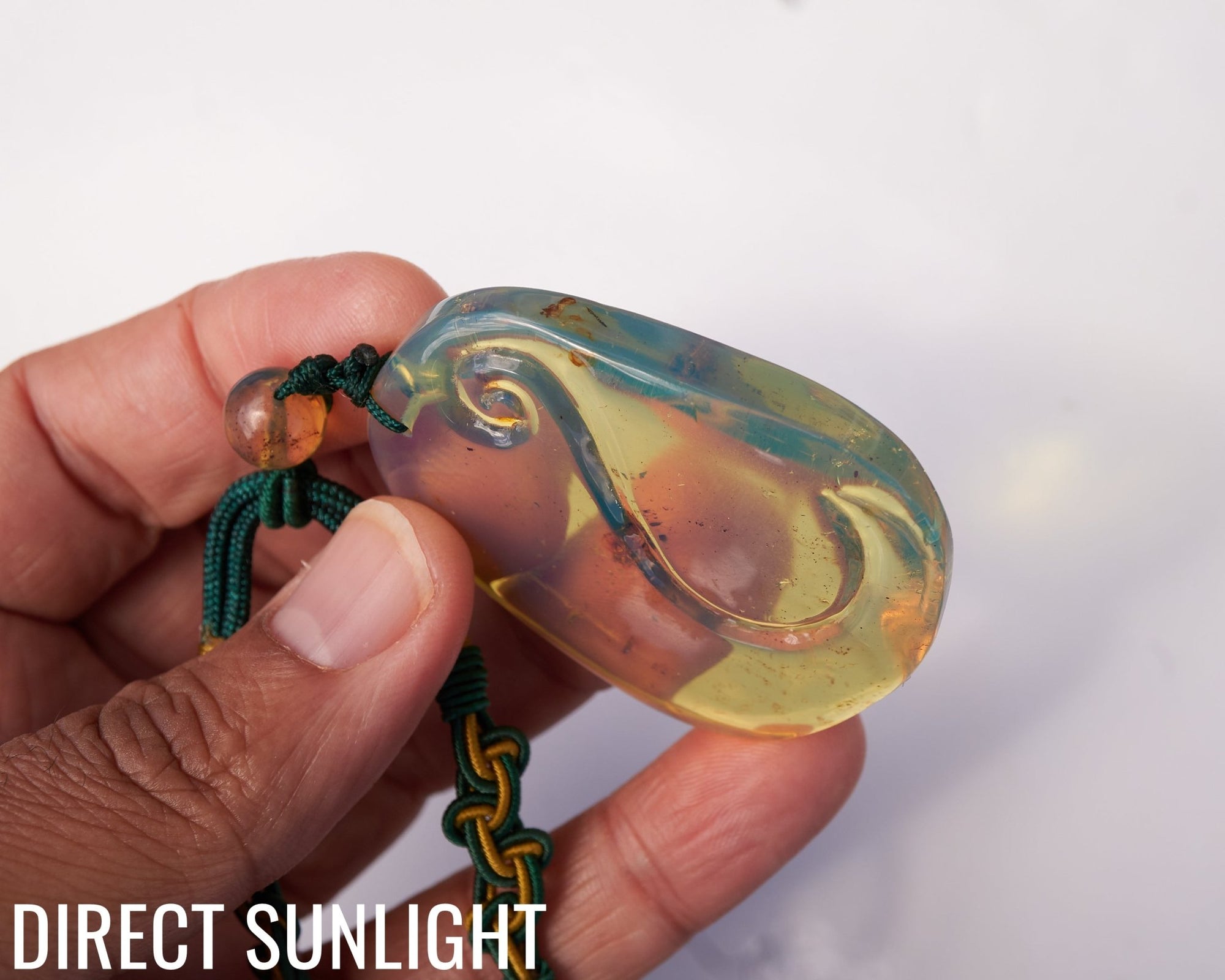 Blue Amber Dominican Pendant Necklace Bell carving shape. - Larimar Creations