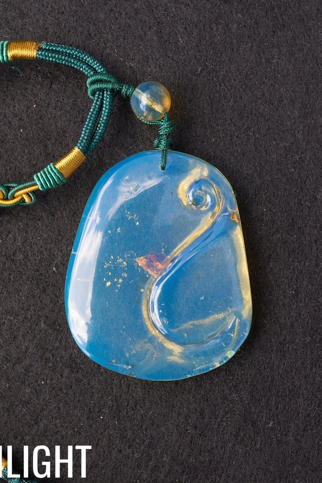 Blue Amber Dominican Pendant Necklace Bell carving shape. - Larimar Creations