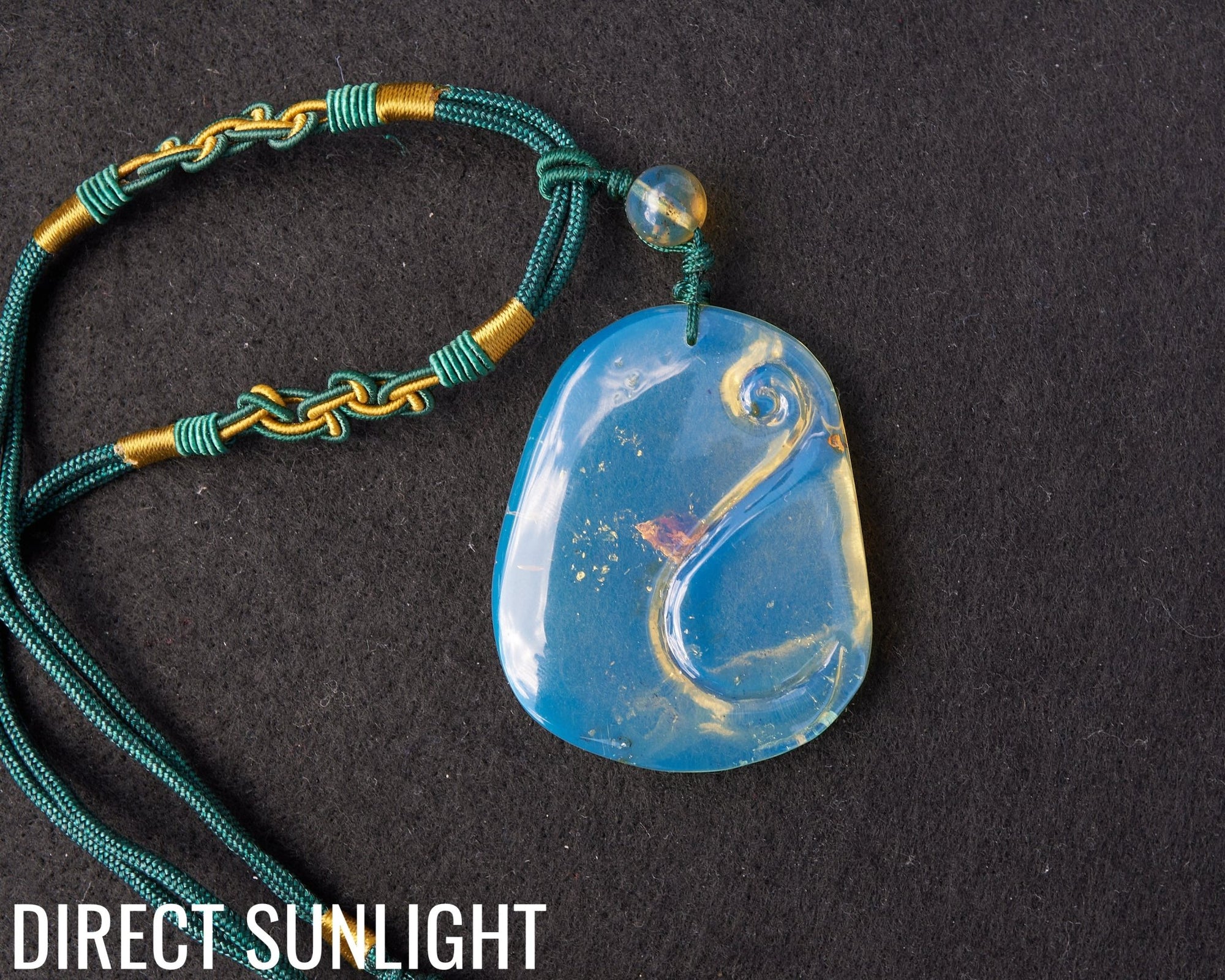 Blue Amber Dominican Pendant Necklace Bell carving shape.