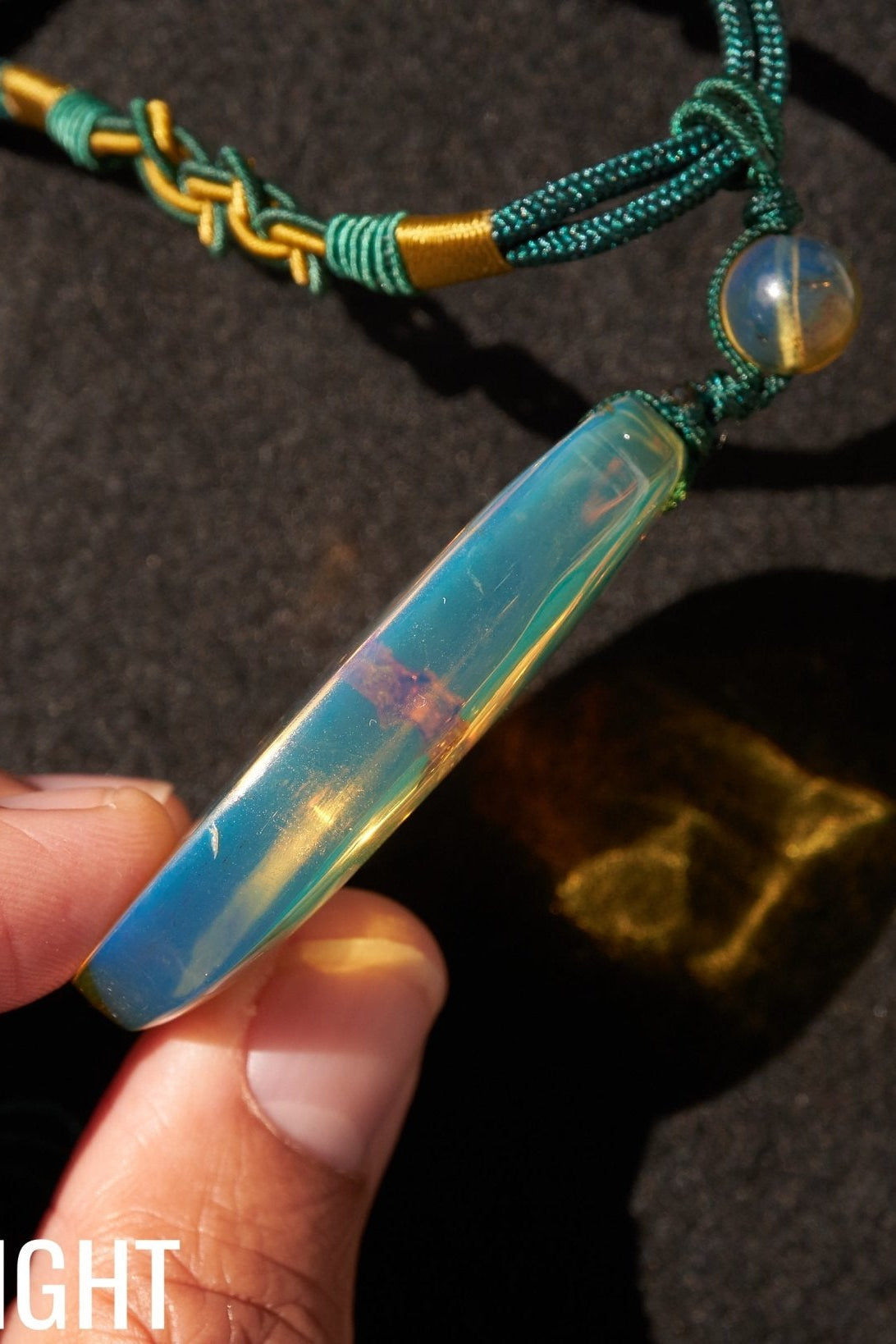 Blue Amber Dominican Pendant Necklace Bell carving shape. - Larimar Creations