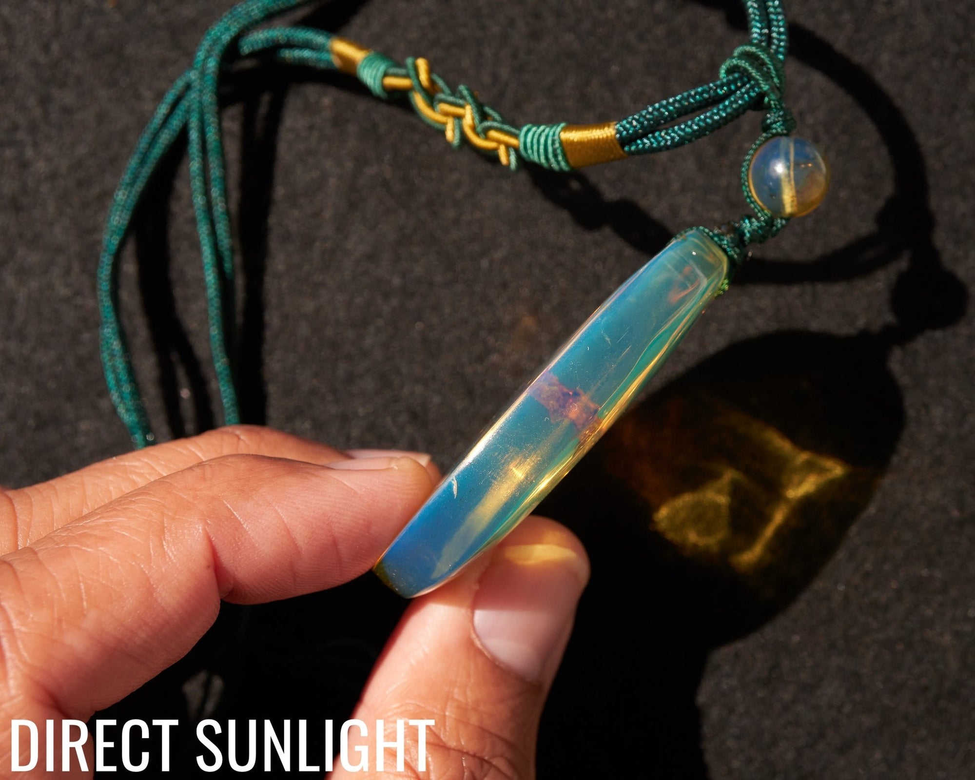 Blue Amber Dominican Pendant Necklace Bell carving shape. - Larimar Creations