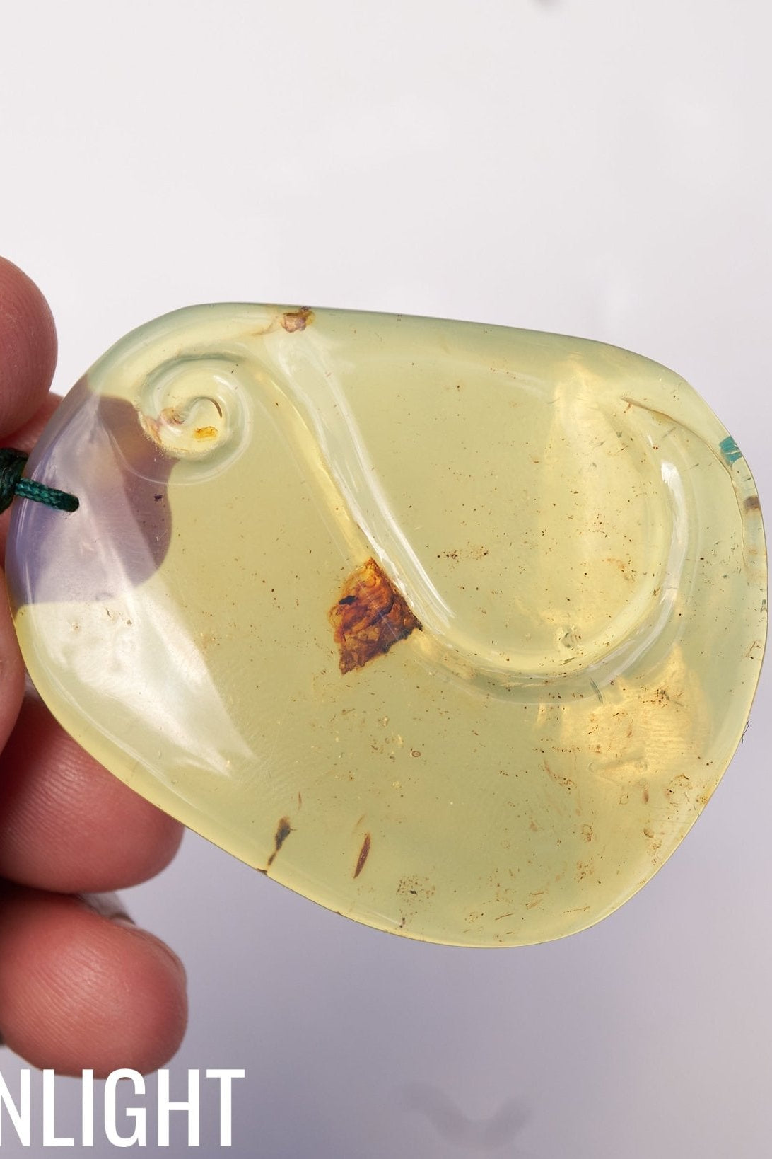 Blue Amber Dominican Pendant Necklace Bell carving shape. - Larimar Creations