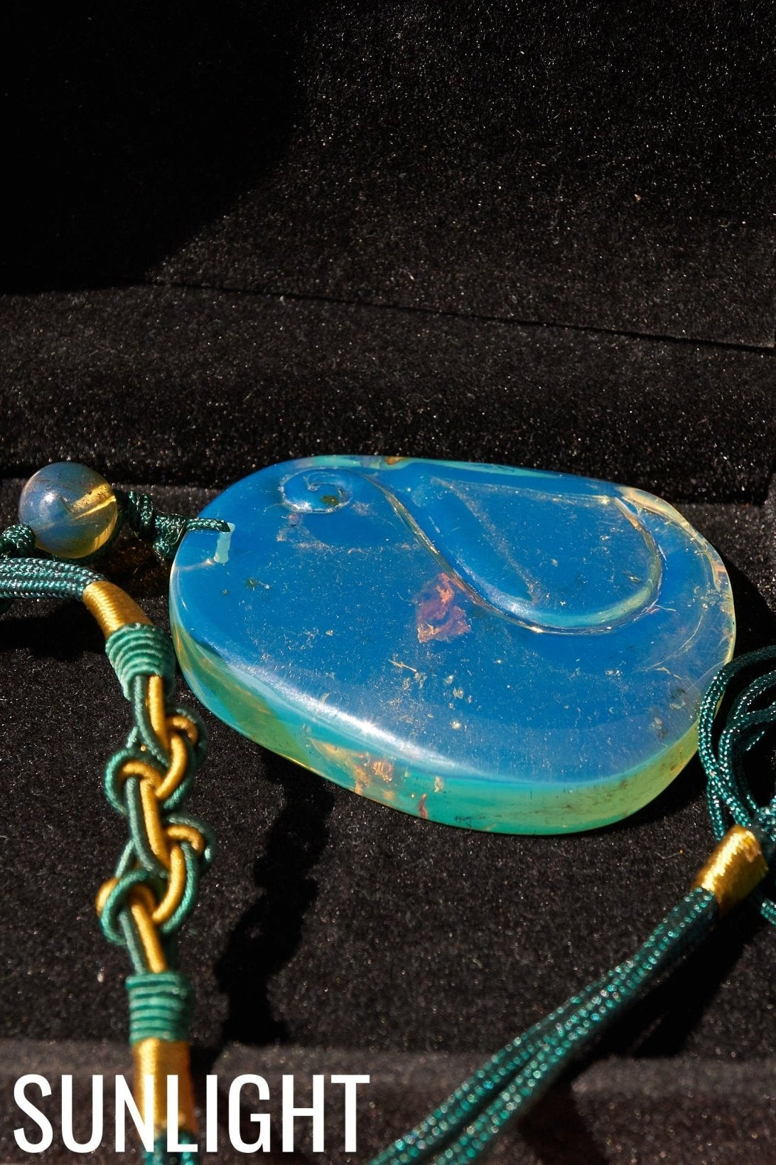 Blue Amber Dominican Pendant Necklace Bell carving shape. - Larimar Creations