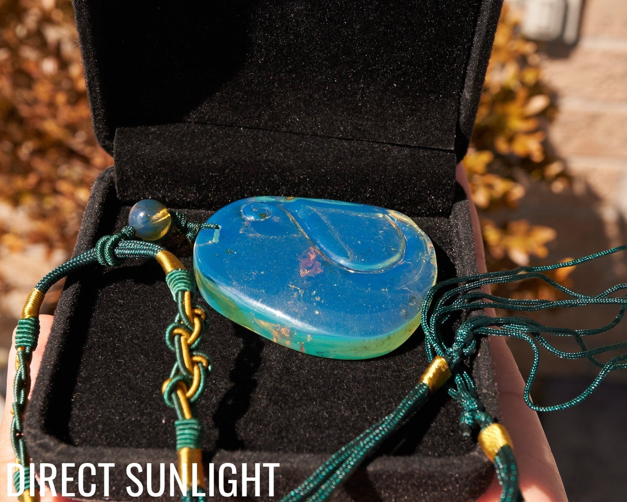 Blue Amber Dominican Pendant Necklace Bell carving shape.