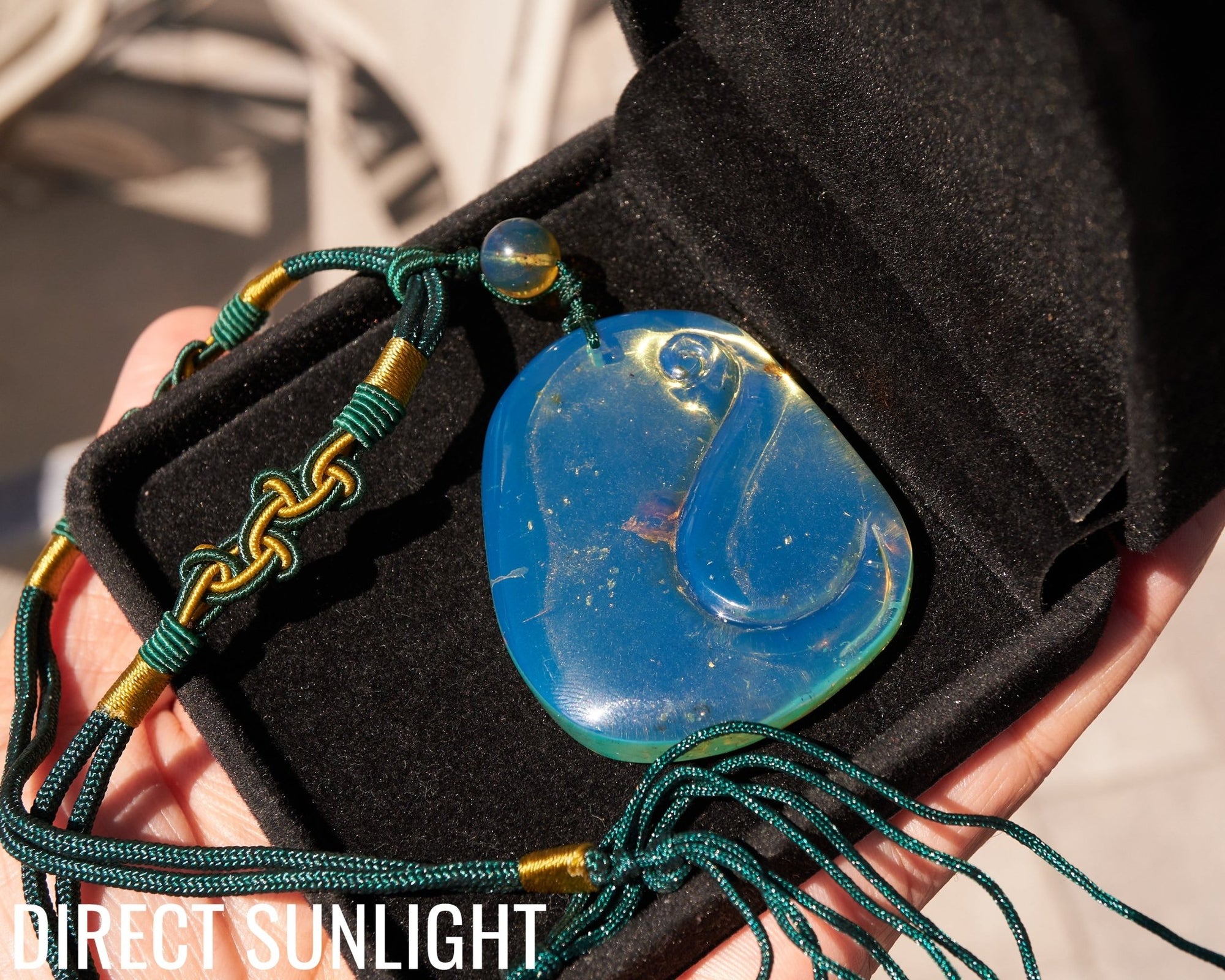 Blue Amber Dominican Pendant Necklace Bell carving shape. - Larimar Creations