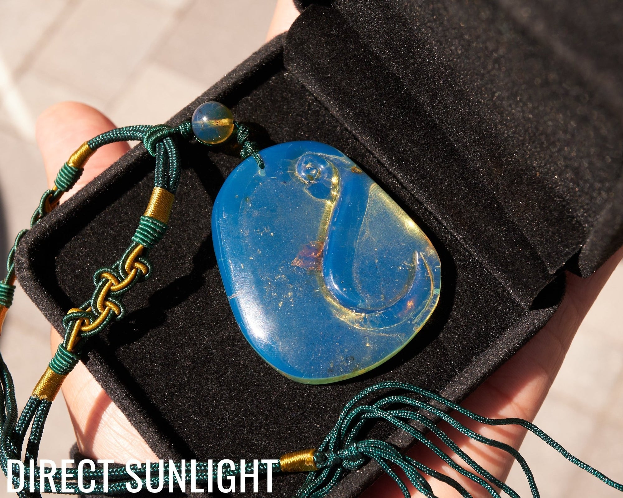 Blue Amber Dominican Pendant Necklace Bell carving shape.