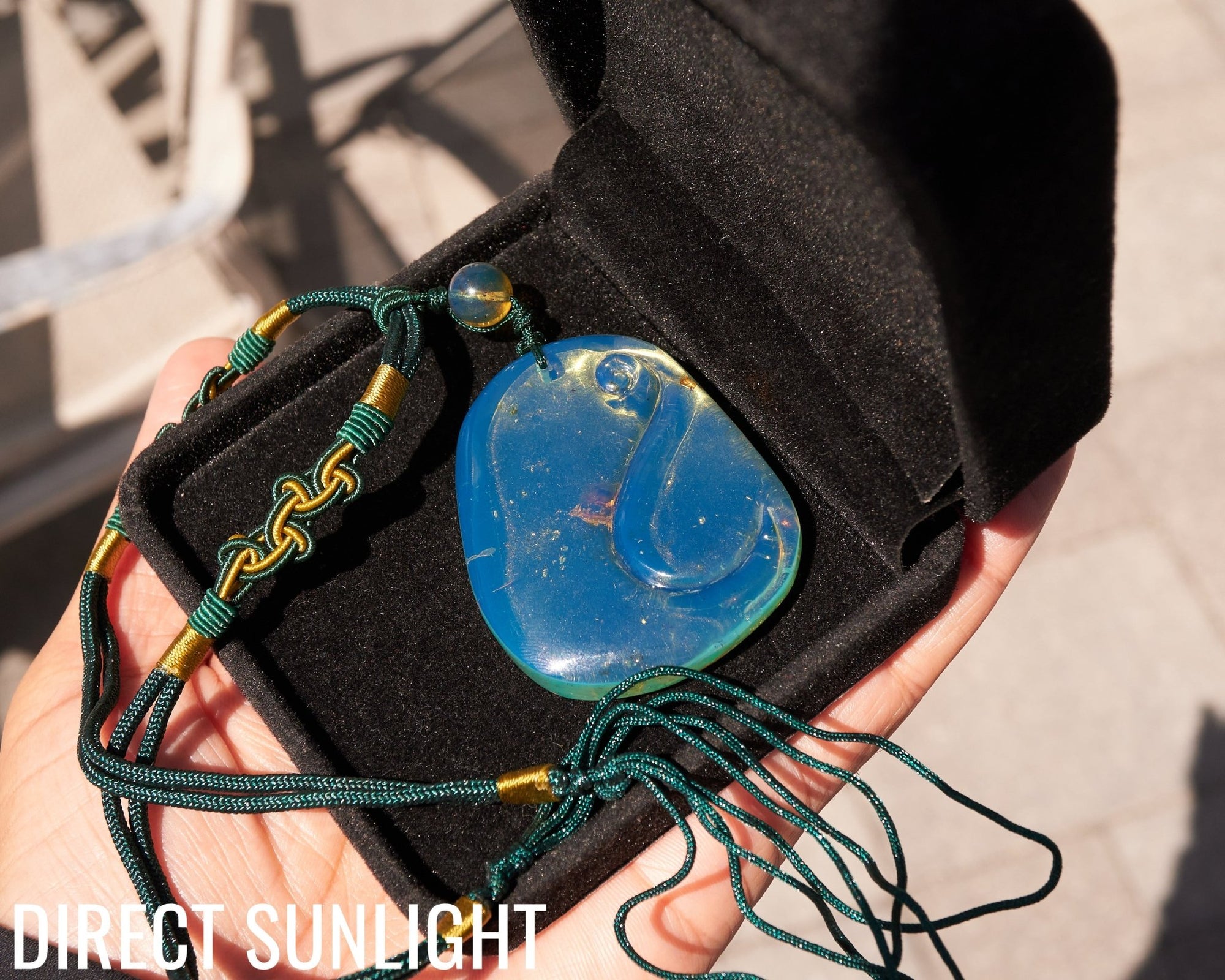 Blue Amber Dominican Pendant Necklace Bell carving shape.