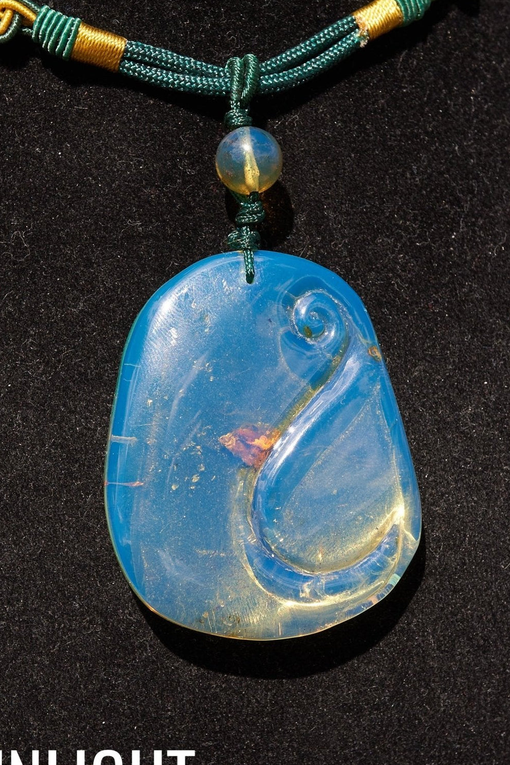 Blue Amber Dominican Pendant Necklace Bell carving shape. - Larimar Creations