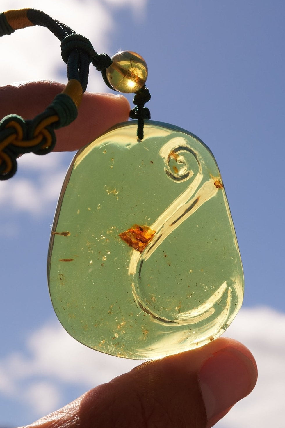 Blue Amber Dominican Pendant Necklace Bell carving shape. - Larimar Creations