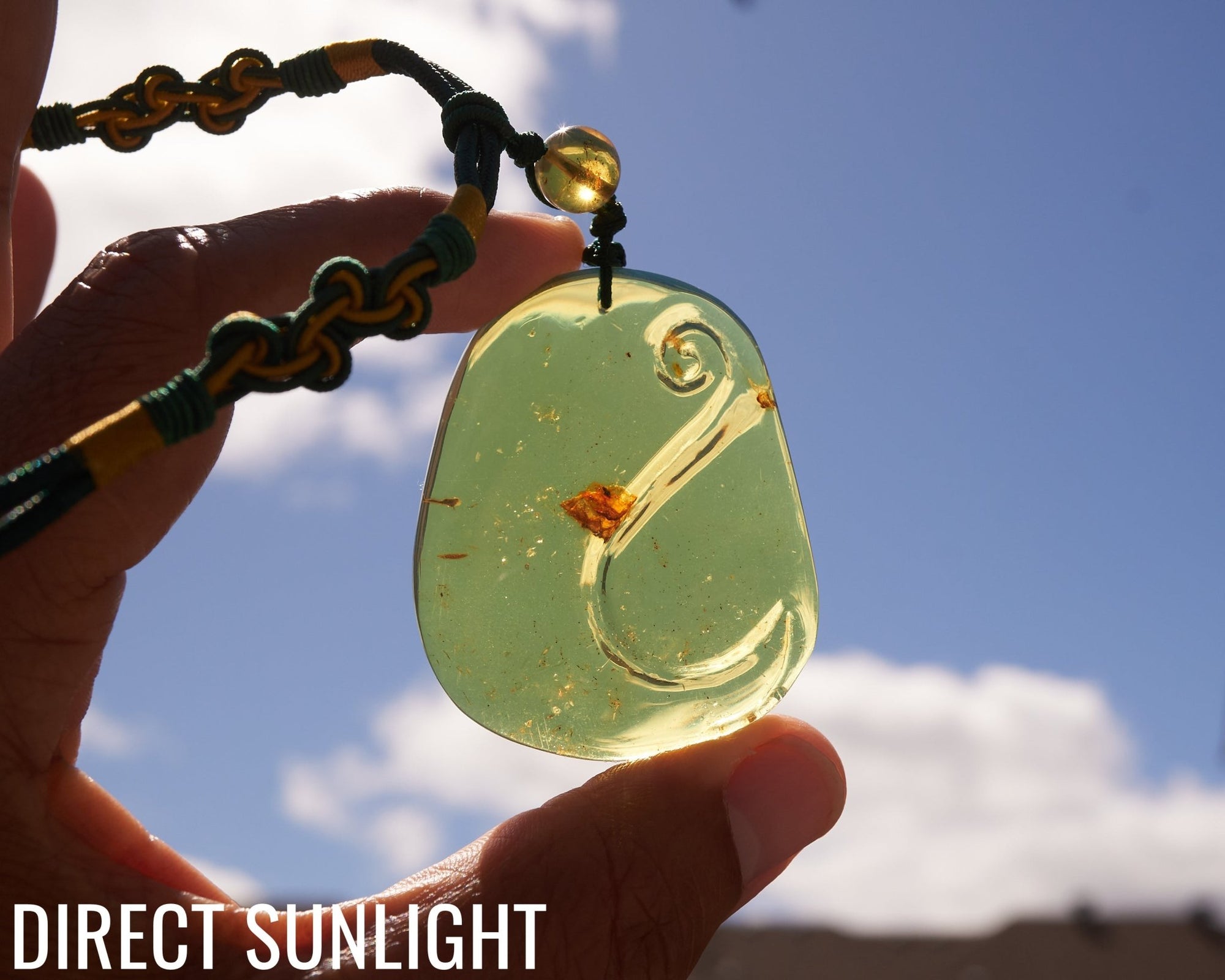 Blue Amber Dominican Pendant Necklace Bell carving shape.