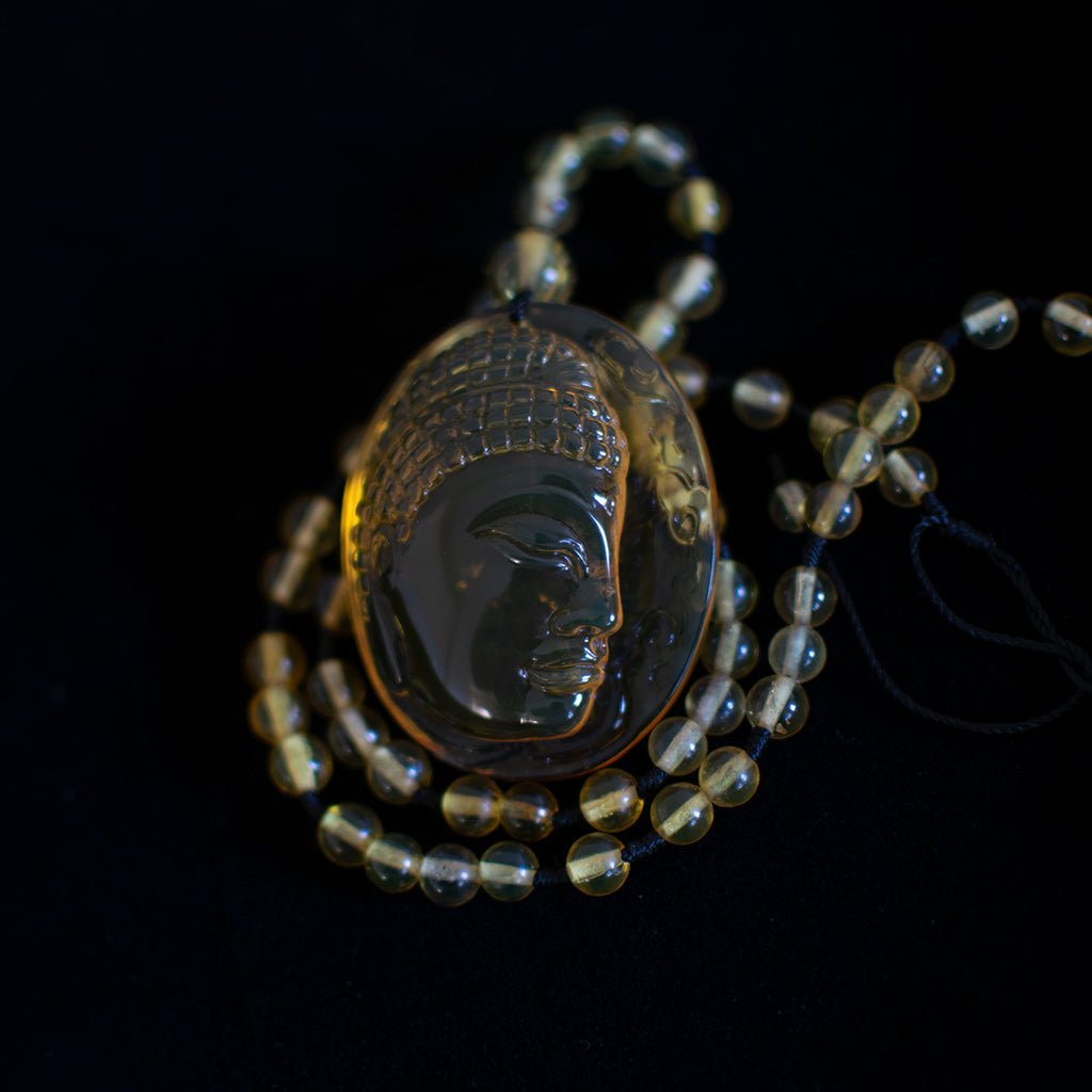 Handcrafted Dominican Amber Beaded Necklace with Buddha Pendant - Larimar Creations
