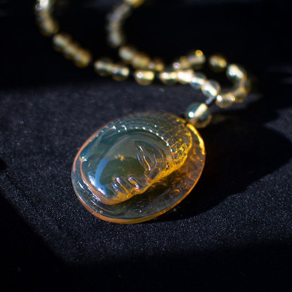 Handcrafted Dominican Amber Beaded Necklace with Buddha Pendant - Larimar Creations