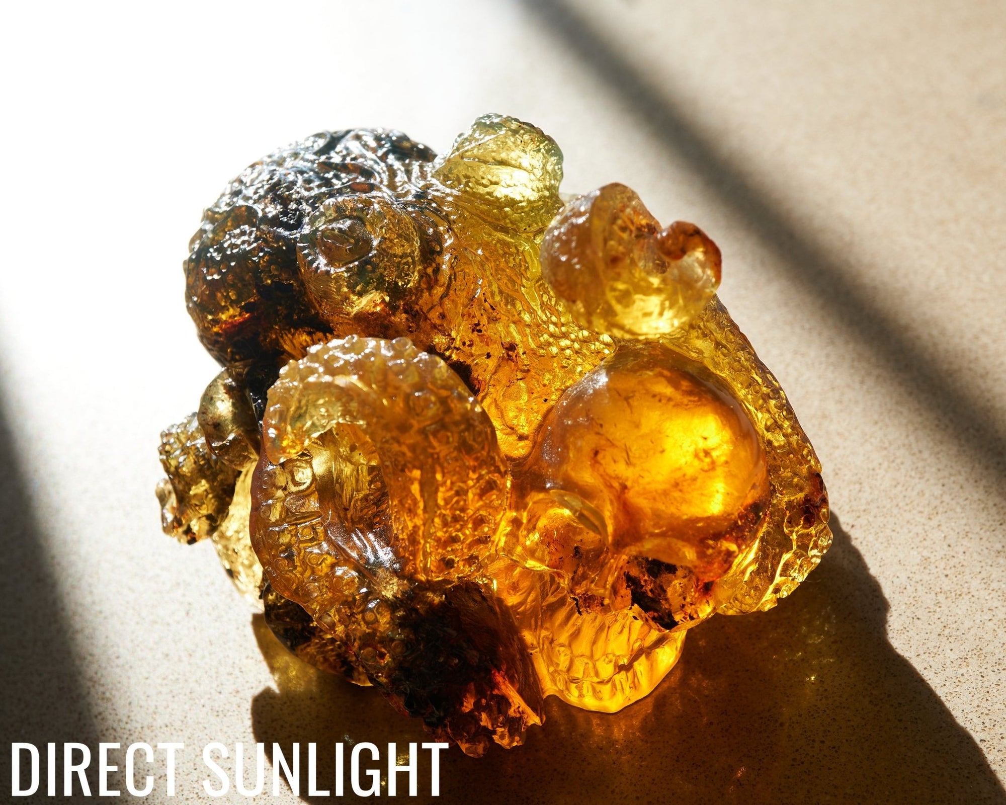 Octopus and Skull Carving Green Amber Dominican