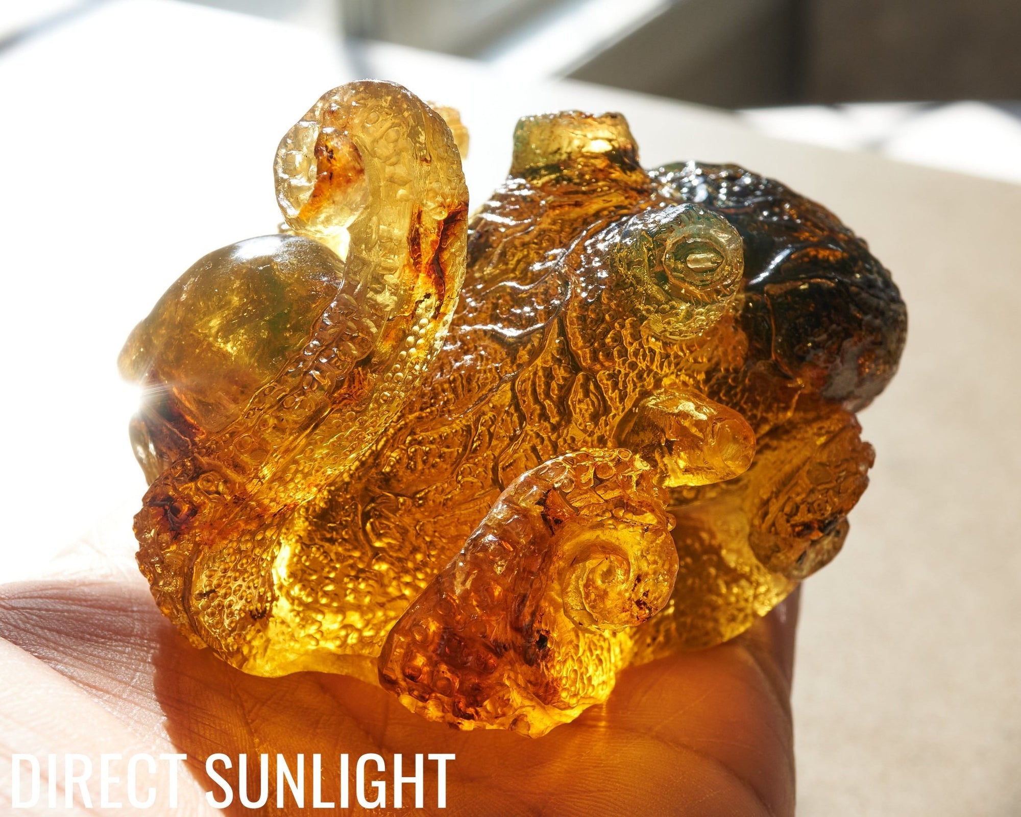 Octopus and Skull Carving Green Amber Dominican