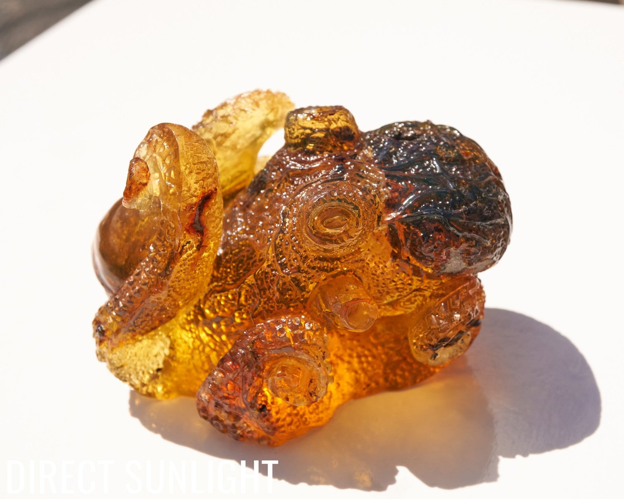 Octopus and Skull Carving Green Amber Dominican