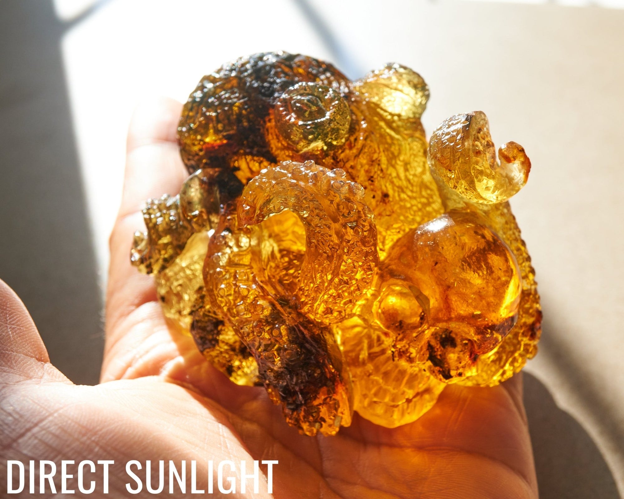 Octopus and Skull Carving Green Amber Dominican