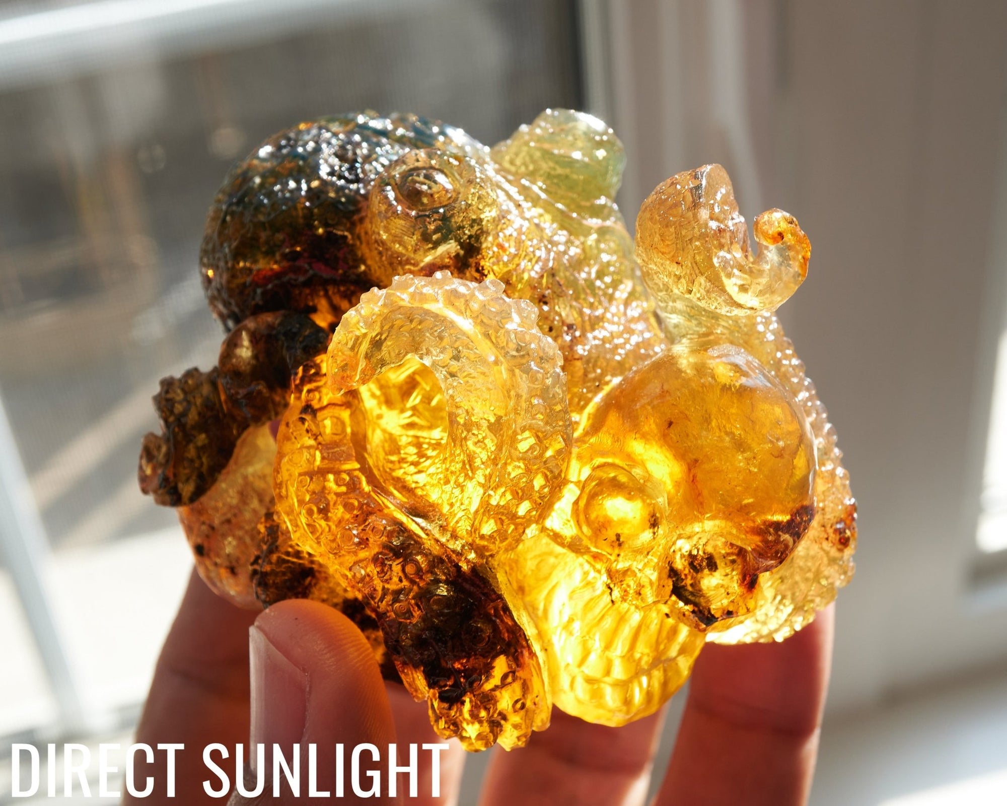 Octopus and Skull Carving Green Amber Dominican