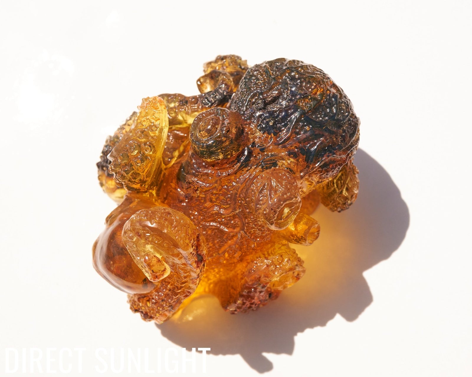 Octopus and Skull Carving Green Amber Dominican - Larimar Creations