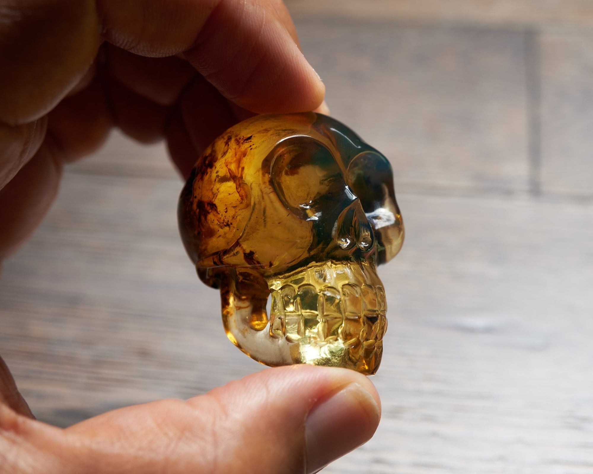 Blue amber skull carving