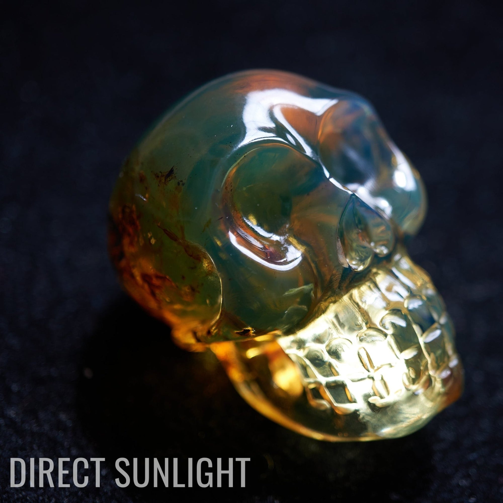 Blue amber skull carving